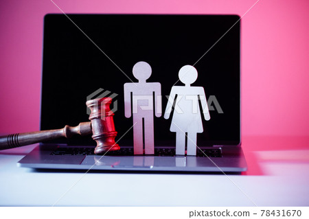 Wooden figure in shape of people and gavel on the table. Family law concept 78431670