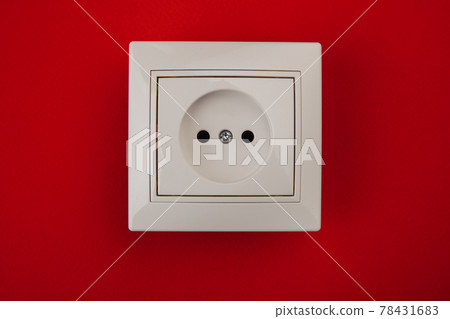 White electrical socket isolated on red 78431683