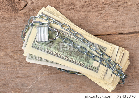 Dollars and locked chain. 78432376