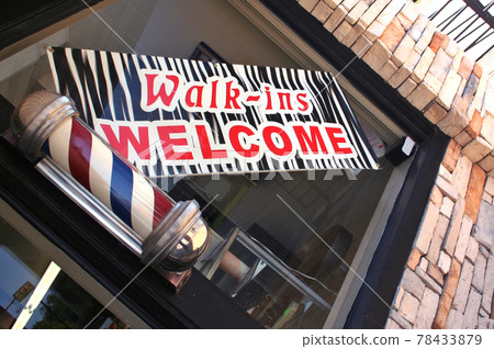 Barbershop Sign in Window With Barber Pole 78433879