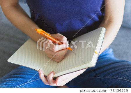 Woman writing in a notebook 3 78434929