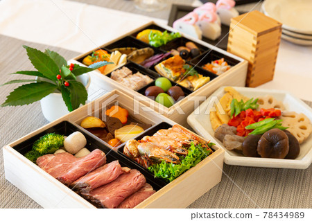 Double-tiered table setting for Western-style New Year dishes 78434989