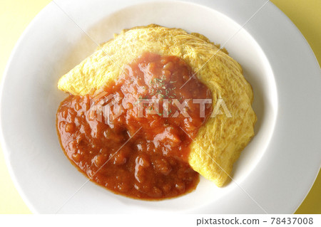 Shooting hot omelet rice with meat sauce on a yellow background (overhead view) Shooting hot omelet rice with meat sauce on a yellow background (overhead view) 78437008
