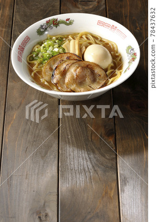 Pork bone soy sauce ramen with roasted char siu, taste balls, menma and all-purpose green onions 78437632