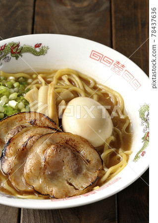 Pork bone soy sauce ramen with roasted char siu, taste balls, menma and all-purpose green onions 78437636