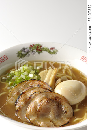 Photographed pork bone soy sauce ramen with roasted char siu, taste balls, menma and all-purpose green onions on a white background 78437852