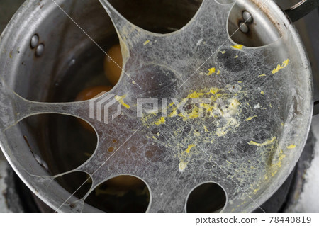 Exploding boiled eggs in a dirty pot on a dirty gas stove Exploding boiled eggs in a dirty pot on a dirty gas stove 78440819