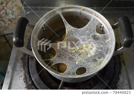 Exploding boiled eggs in a dirty pot on a dirty gas stove Exploding boiled eggs in a dirty pot on a dirty gas stove 78440823