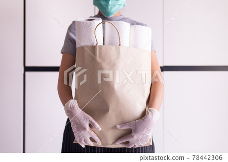 Woman stocking up toilet paper during situation coronavirus panic and outbreak at home quarantine Woman stocking up toilet paper during situation coronavirus panic and outbreak at home quarantine 78442306