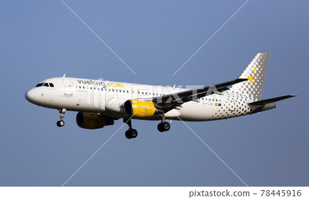 Airplane airbus a320 of Vueling airlines approaches for landing 78445916