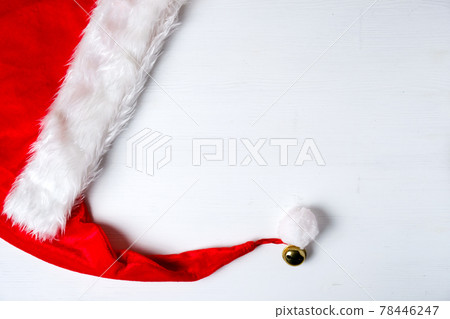Santa Claus red hat with tassel and bell on background with copy Santa Claus red hat with tassel and bell on background with copy 78446247