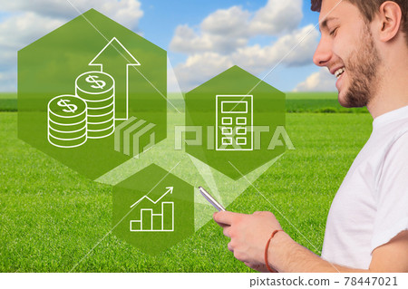 Closeup of man farmer using smart farming app on smartphone Closeup of man farmer using smart farming app on smartphone 78447021