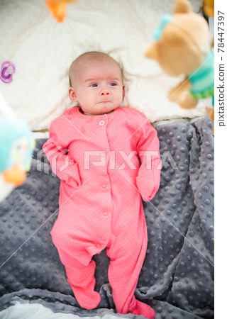 Newborn with very sad face start to cry Newborn with very sad face start to cry 78447397
