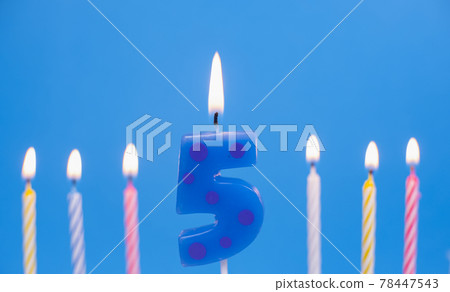 Burning birthday cake candle number 5. Happy Birthday background anniversary celebration concept Burning birthday cake candle number 5. Happy Birthday background anniversary celebration concept 78447543