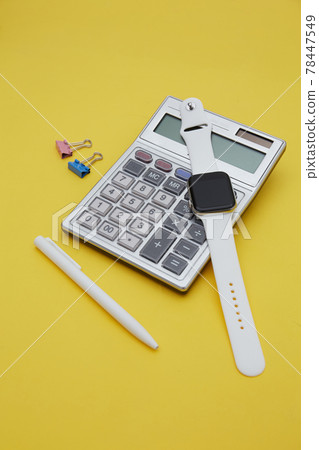 Top view of sketch book , pencil and calculator isolated on yellow. Finance concept	 78447549