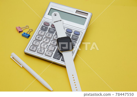 Top view of sketch book , pencil and calculator isolated on yellow. Finance concept Top view of sketch book , pencil and calculator isolated on yellow. Finance concept 78447550