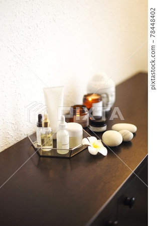 Candles and skincare products on table Candles and skincare products on table 78448402