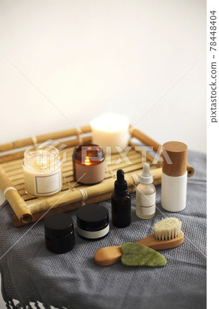 Candles and skincare products on table Candles and skincare products on table 78448404