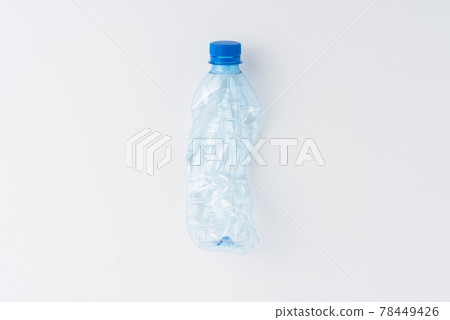 Used plastic bottle of water isolated on white background. Recycling concept. Flat lay Used plastic bottle of water isolated on white background. Recycling concept. Flat lay 78449426