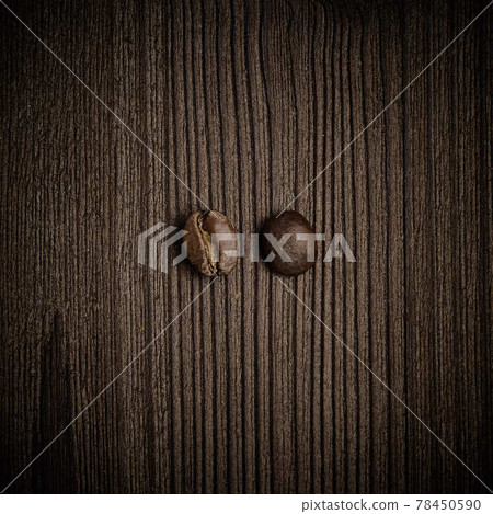 Two coffee beans in white background, top view. Two coffee beans in white background, top view. 78450590