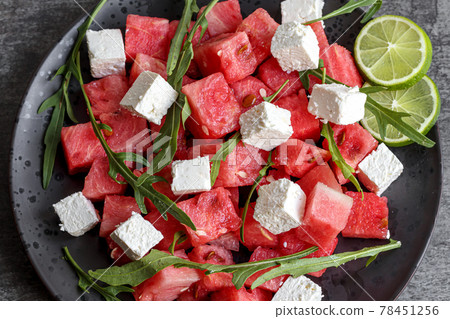 Watermelon salad with mozzarella, feta, arugula 78451256