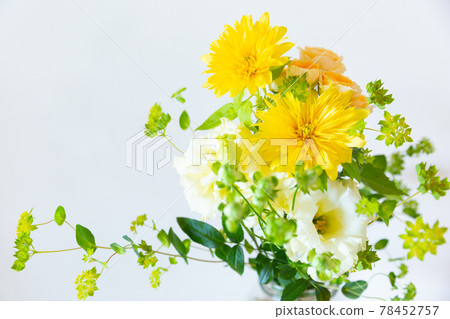 Yellow sunflower and white eustoma in a glass Yellow sunflower and white eustoma in a glass 78452757