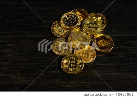 Closeup golden coin with bitcoin logo. Leader in cryptocurrency Bitcoin BTC on a top of coins against black wooden surface. Pile of decentralized digital currency. Crypto payment. Electronic money. Closeup golden coin with bitcoin logo. Leader in cryptocurrency Bitcoin BTC on a top of coins against black wooden surface. Pile of decentralized digital currency. Crypto payment. Electronic money. 78455061