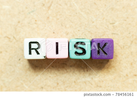 Color alphabet letter block in word risk on wood background 78456161