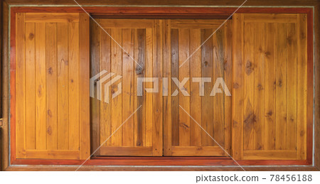 Natural old wood or timber door and window frames pattern surface texture. Close-up of architecture material for exterior design decoration background. Natural old wood or timber door and window frames pattern surface texture. Close-up of architecture material for exterior design decoration background. 78456188