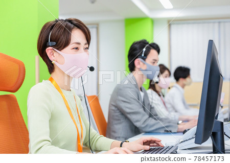 Staff working with masks and headsets Staff working with masks and headsets 78457173