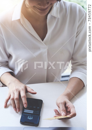 Female using mobile banking application for paying house,tax and bill Female using mobile banking application for paying house,tax and bill 78459772