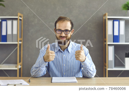 Happy young businessman or office worker showing that he's satisfied with work results 78460006