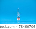 Invention vaccine from 2019-nCoV. Glass ampoules for injection with coronavirus vaccine on blue background with space for text. Concept of fighting Sars-nCov, vaccinating people against Covid19 virus 78460706
