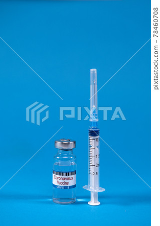 virus 2019-nCoV defeated. Invented coronavirus covid-19 vaccine in glass medicine bottle, syringe for injection on blue background with space for text. Concept of victory over epidemic of Sars-nCoV-2 virus 2019-nCoV defeated. Invented coronavirus covid-19 vaccine in glass medicine bottle, syringe for injection on blue background with space for text. Concept of victory over epidemic of Sars-nCoV-2 78460708