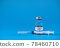 Vaccine for treatment of COVID-19 coronavirus with syringe on blue background with space for text. World vaccination against SARS-nCoV epidemic. Concept fighting and defeating coronavirus 2019-nCoV. 78460710