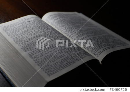 Open christian Bible on a wooden Slate Table Open christian Bible on a wooden Slate Table 78460726