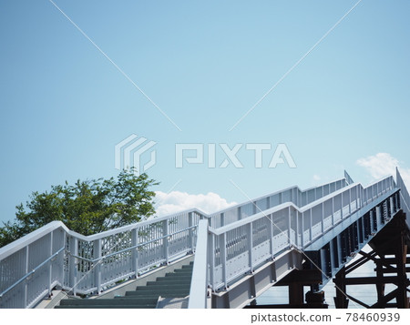 Temporary pedestrian bridge and blue sky Temporary pedestrian bridge and blue sky 78460939