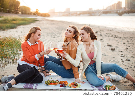 Happy young women resting during picnic 78461250