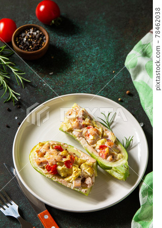 Healthy food concept. Baked zucchini with meat and tomatoes on a stone table. Copy space. Healthy food concept. Baked zucchini with meat and tomatoes on a stone table. Copy space. 78462038