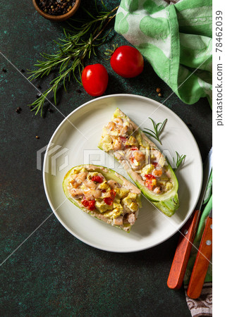 Healthy food concept. Baked zucchini with meat and tomatoes  on a stone table. Copy space. 78462039