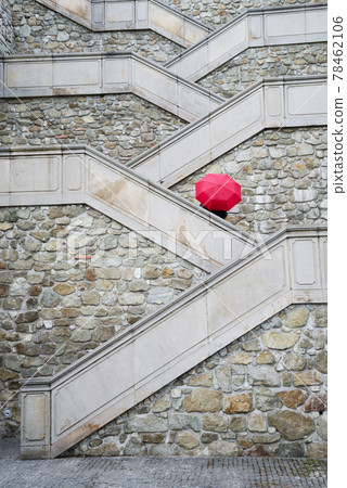 Red umbrella on the beautiful stairs to Bratislava castle, Slovakia. Red umbrella on the beautiful stairs to Bratislava castle, Slovakia. 78462106