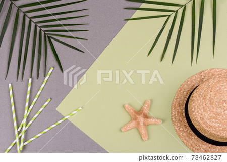 Beach accessories: glasses and hat with shells and sea stars on a colored background. Summer background 78462827