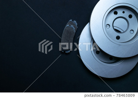 Auto equipment. Auto motor mechanic spare or automotive piece on black background. New metal car part. Repair and vehicle service with space for text. 78463809