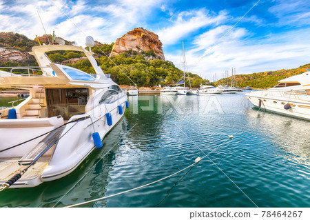 Enchanting view of Poltu Quatu port and bay with luxury yachts on Costa Smeralda. Enchanting view of Poltu Quatu port and bay with luxury yachts on Costa Smeralda. 78464267
