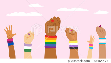 Group of raised up fists wearing different LGBT identity flags on wristband 78465475