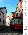 Red tram tram around the curve of Lisbon, Portugal 78467093
