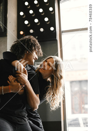 Mixed couple spenting time together in a cafe Mixed couple spenting time together in a cafe 78468389