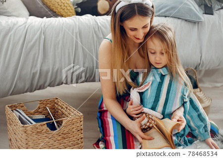 Mother with little daughter in a room Mother with little daughter in a room 78468534
