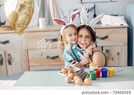 Mother with little daughter in a kitchen 78468569
