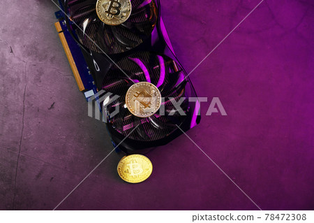 Bitcoin on a graphic card with a Pink neon light on a dark background. Bitcoin on a graphic card with a Pink neon light on a dark background. 78472308